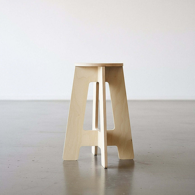 A-Stool made from birch plywood, featuring clean lines and a solid build, perfect for sitting or perching.