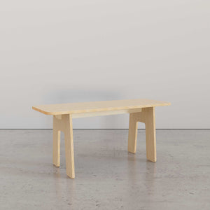 Sleek Modern Bench in light wood, showcasing minimalist design and sturdy legs, ideal for any modern living space.