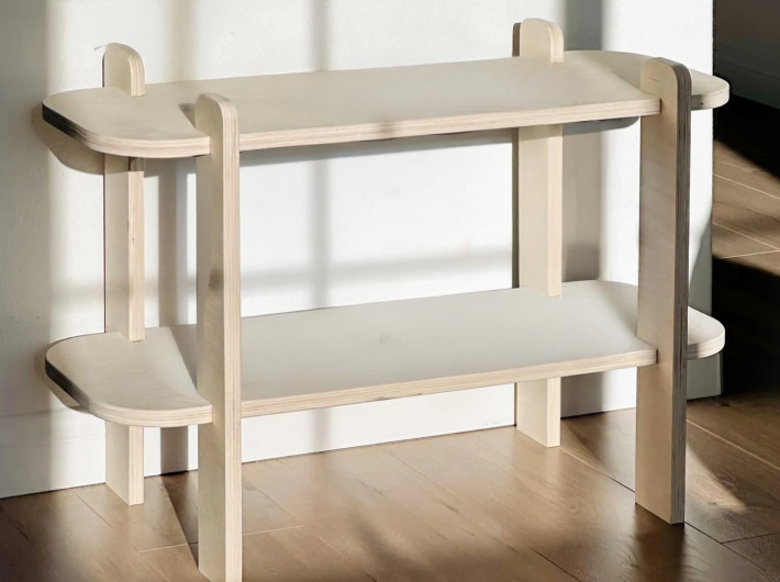 Minimalist wooden shelf with curved edges, perfect for modern interior decor and organizing essentials.