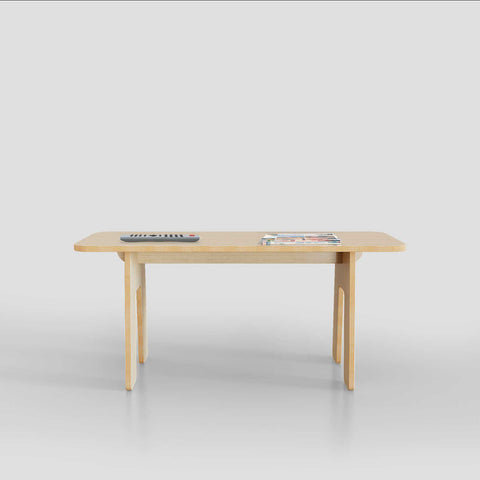 Modern wooden table with magazines on top, minimalistic design for contemporary living spaces.