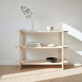 Large unfinished modern shelf displayed in a bright living room setting