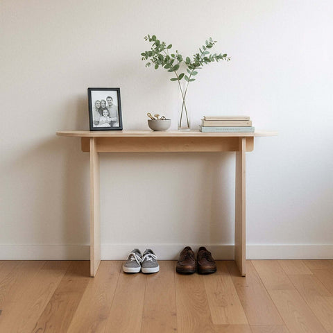 Modern Console Table with plants and photo frame in an entryway, showcasing minimalist design and functionality.