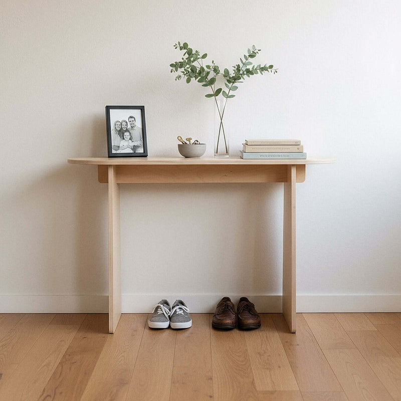 Modern Console Table with plants and photo frame in an entryway, showcasing minimalist design and functionality.
