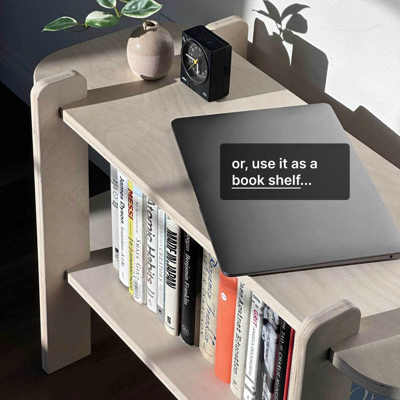 Creative shelving solution with books and a suggestion to use the surface for a laptop or as a bookshelf.