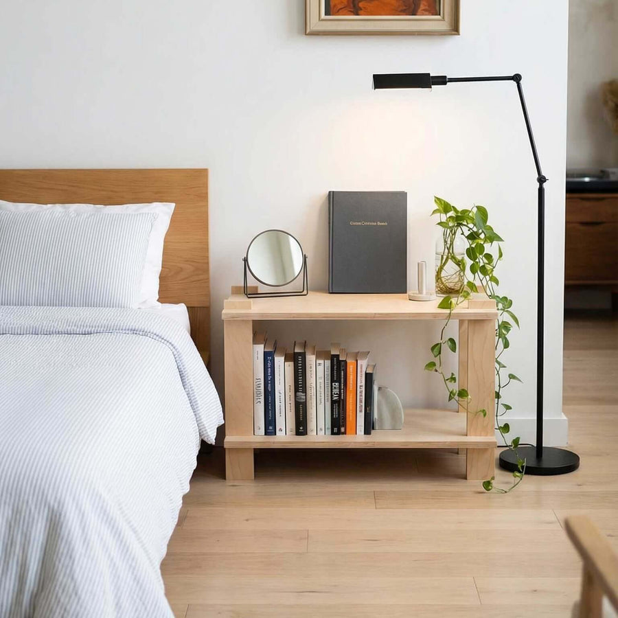 Modular Shelf next to a bed with books, a mirror, and a plant, perfect for home or office use.