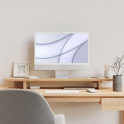 Ergonomic unfnshed.liveputer Monitor Stand elevating monitor on a wooden desk with organized workspace.