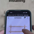 User installing unfinished wall shelves on a smartphone screen, showcasing customization options.